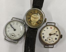 Three early 20th century gents trench watches to include a Voortrekker watch having a black