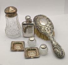 Silver comprising two ashtrays, a hairbrush, a salt and pepper, a sugar caster and a silver plated