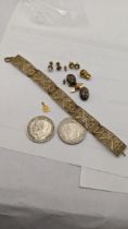 A mixed lot to include a yellow metal tooth and St Christopher's pendant, 2.5, filigree bracelet,