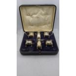 A six piece condiments hallmarked Birmingham 1918, total weight excluding glass 226g, box A/F