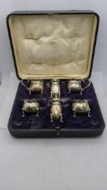 A six piece condiments hallmarked Birmingham 1918, total weight excluding glass 226g, box A/F