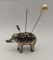 A white metal pin cushion in the form of an elephant A/F Location: