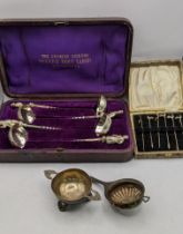 The Charles Dickens Pickwick toddy ladles silver plated, along with a white metal tea strainer and a