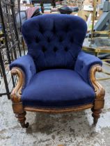 A Victorian walnut framed upholstered nursing chair, blue button back upholstery, turned front