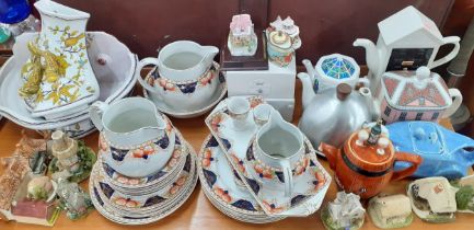 Mixed teapots to include a Sadler lilac glazed racing car teapot and a miniature enamelled example