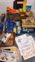 A quantity of vintage Meccano in various storage boxes to include instructions for a Road