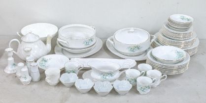 A Royal Staffordshire dinner service decorated with white flowers and foliage to include a salt