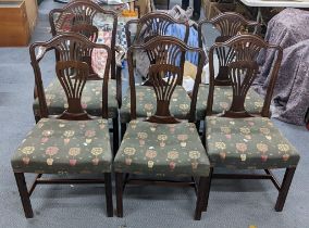 A set of five late 19th/early 20th century mahogany and upholstered dining chairs and one carver