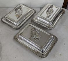 Three early 20th century silver plated entree dishes, two having gadrooned rims and one other