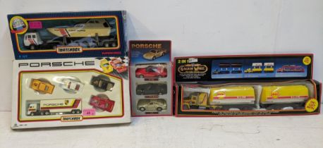 Four presentation packs, one Matchbox Porsche pack to include for cars and a lorry, ( Serial