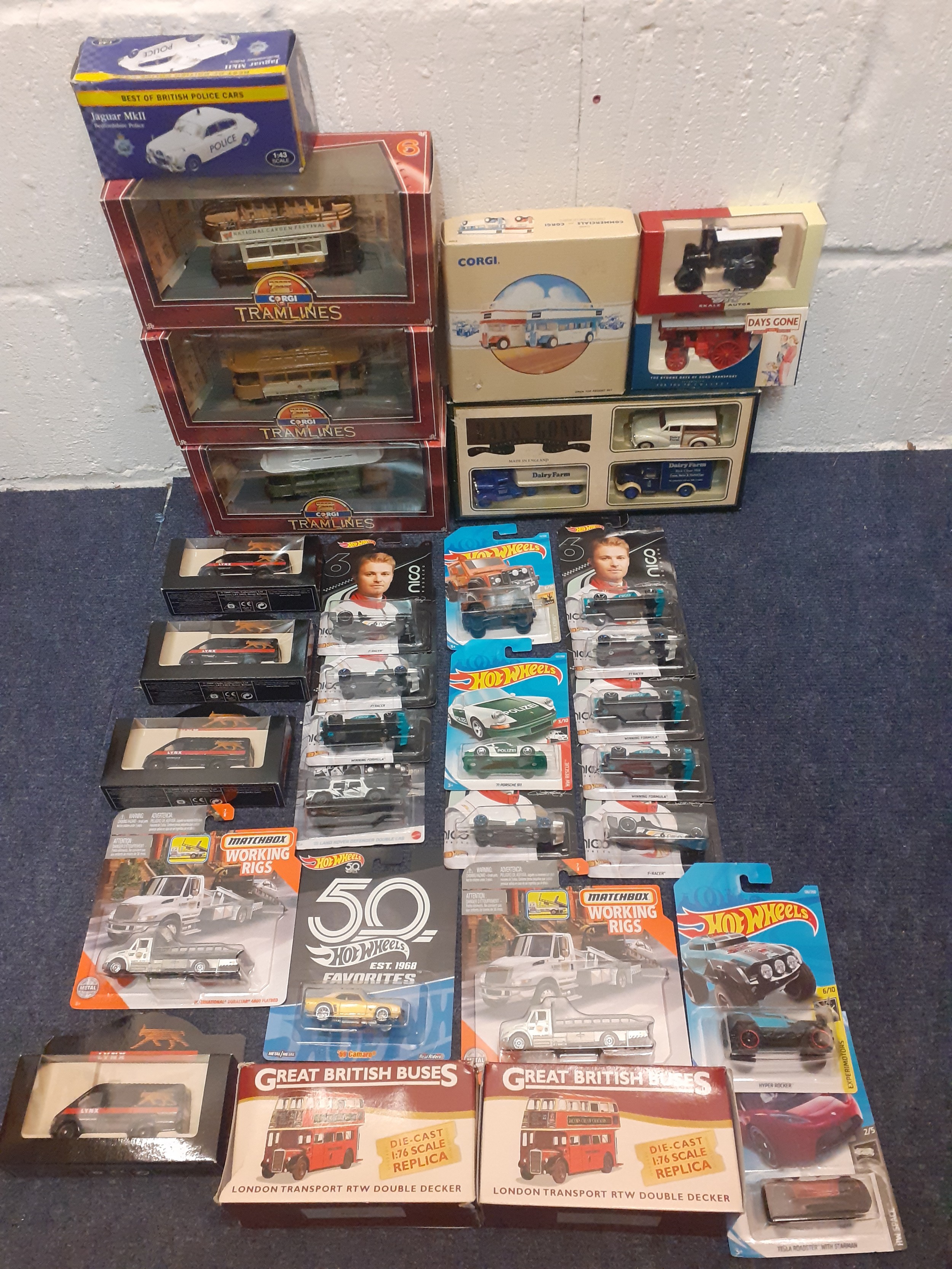 A quantity of die cast collectors vehicles to include Hot Wheels, Corgi buses and Tramlines, Days