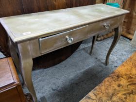 A gold painted hall table with two frieze drawers with glass handles 75cm x 111cm x 36cm Location: