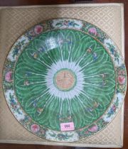 An early 20th century Chinese Canton famille rose charger decorated with leaves and butterflies