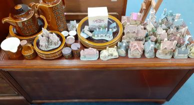 A Hornsea 'Bronte' dinner service in brown to include spice jars together with collectors cottages