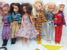 Six 1980's Sindy dolls stamped 033055X to the rear of the neck wearing clothing and footwear