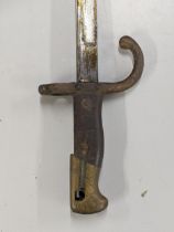 A 19th century French 'Gras' bayonet having 52cm triangular blade, signed to back and dated 1875,