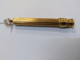 S Mordan & Co - an 18ct gold cased sliding pencil with a cylindrical ribbed body, inscribed NS