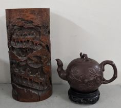 An early 20th century Chinese carved bamboo brush pot together with Yixing teapot character marks to