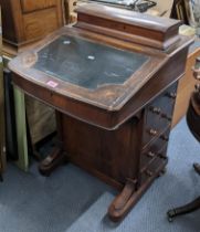 A late Victorian walnut Davenport having a fitted interior and four drawers to one side 81cm h x