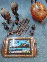 A quantity of African treen to include two carved busts together with a butterfly wing tray and