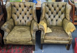 A pair of mid 20th century green leather stud and button back upholstered wingback Chesterfield