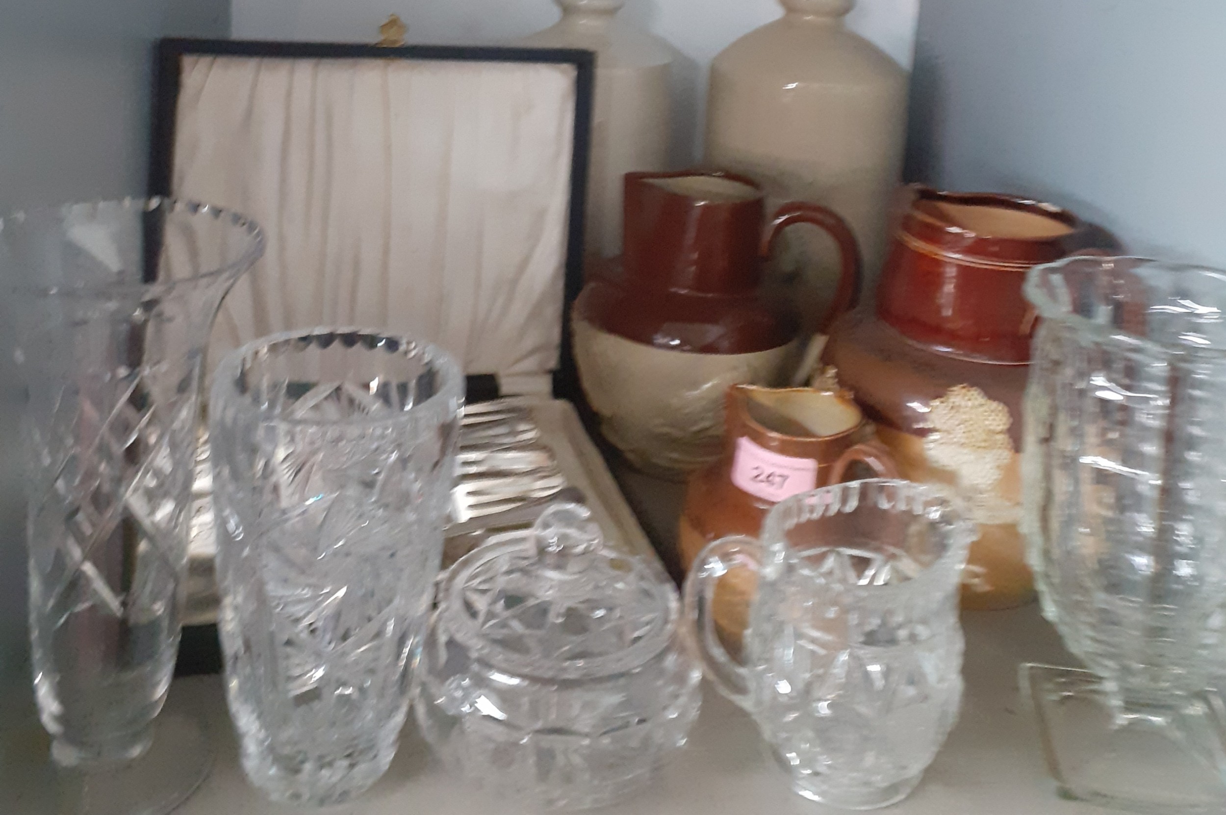 Three Doulton Lambeth jugs of various sizes and a pair on stone bed warmers and other household