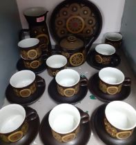 A 1970's Denby pottery 'Arabesque' tea service, 10 setting (one cup handle A/F) to include hot water