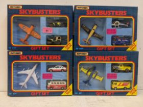 Four Matchbox Skybusters gift sets to include a US Navy plane with an armoured vehicle and jeep, a