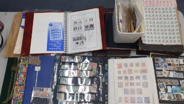 A partially filled 'Life & Times of HM Queen Mother' stamp album together with empty vintage albums,