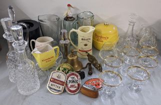 A mixed lot to include a pair of Waterford Alana crystal decanters, pub beer pump clips and other
