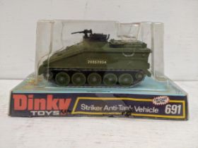 A Dinky toy 691 Striker Anti Tank vehicle with 20357034 on the side, boxed. Location: