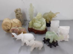 A quantity of jade, jadeite and onyx collectables to include model elephants and buddhas Location: