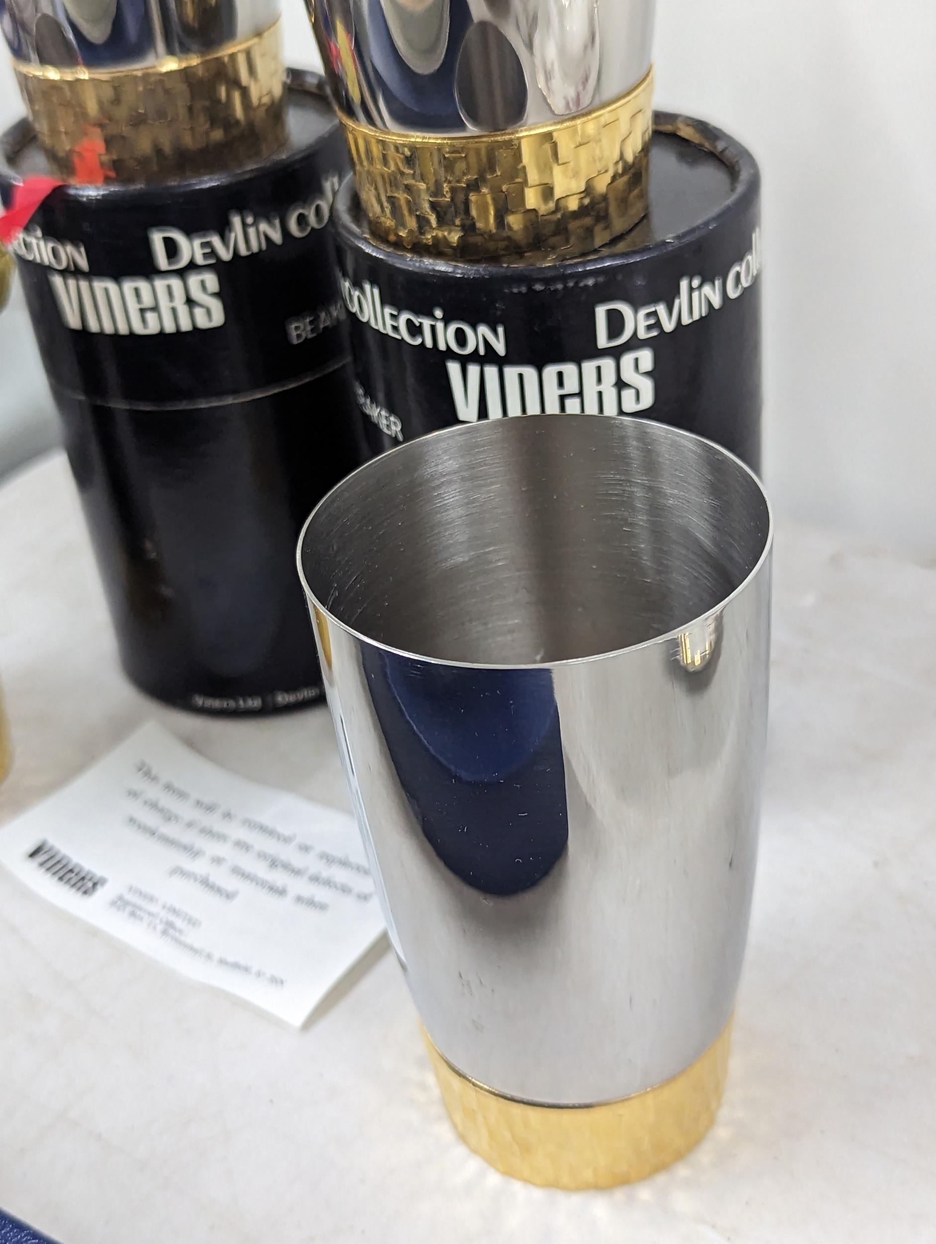 Stuart Devlin for Viners, a group of four stainless steel and gilt metal beakers, two with - Image 2 of 3