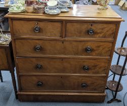 A 19th century walnut chest of two short and three long drawers having turned handles and on a