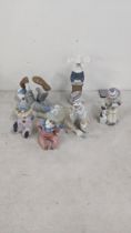 A group of four Lladro figurines and one Lladro Nao figuring to include 4618 reclining clown with
