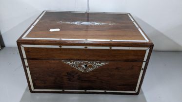 A Victorian rosewood and mother of pearl vanity box enclosing silver plated and glass jars and boxes