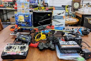 A collection of model planes and remote control helicopters to include Helicopter Swan and Fly