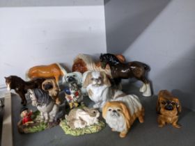 A selection of ceramic and resin model animals to include a Royal Doulton and Royal Copenhagen