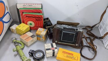 A Zeiss Ikon Super Ikonta camera together with mixed accessories, a leather cased compass and