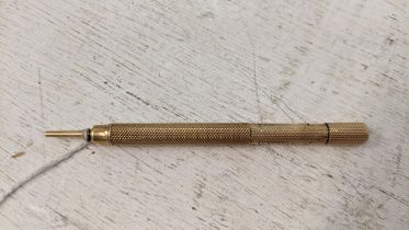 A Samson Mordan & co gold plated propelling pencil with engine turned decoration: Location: