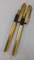 An Alfred Dunhill gilt metal fountain pen with 18k nib together with a gilt metal messenger fountain