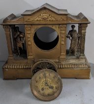 A late 19th century French gilt metal clock of architectural design having two mantel classical