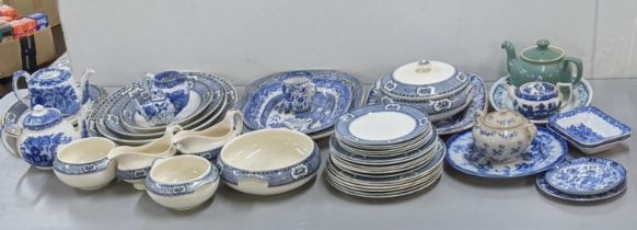A mixed lot of blue and white ceramics to include various serving plates, dinner and side plates,