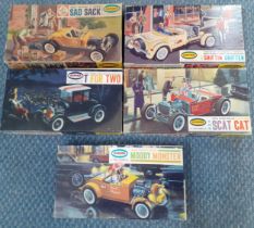 Five Aurora plastic assembly kits 1/32 scale to include a 1928 Chevy Riod Moody Monster kit and a