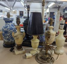 A collection of nine table lamps to include an Adam style example with applied gilt motifs, marble