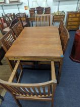 A vintage teak extend dining table on block shaped legs, 73cm h x 121.5cm w unextended, together