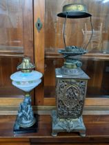 Two Victorian cast metal oil lamps with opaline glass reservoir Location: G
