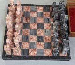 A marble chess board having carved chess pieces Location:FSR