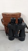 A pair of Kershaw Vanguard binoculars in a fitted leather carry case together with a large