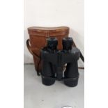 A pair of Kershaw Vanguard binoculars in a fitted leather carry case together with a large
